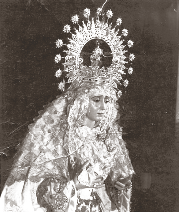 La antigua Virgen de la Salud, realizada por Rafael Lafarque, entre los años 1943 y 1944 y que, desde su bendición el 20 de febrero de este último año, fue Titular mariana de la Hermandad de San Gonzalo hasta que el incendio acaecido en la Parroquia del Barrio León el 8 de abril de 1977 la dejó tan deteriorada que la Hermandad decidió reemplazarla por otra Imagen que pasó a encomendar a Luis Ortega Bru.